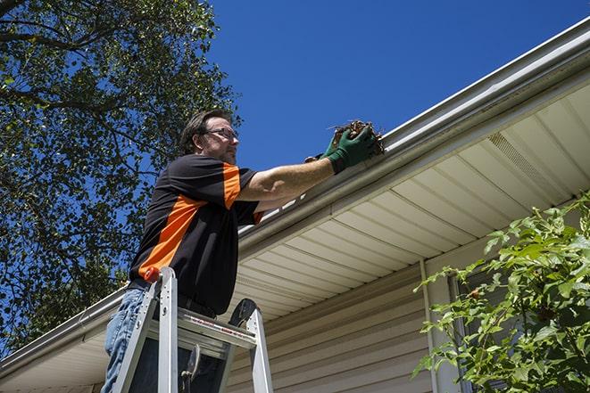 a damaged gutter getting a much-needed repair in Jamesport
